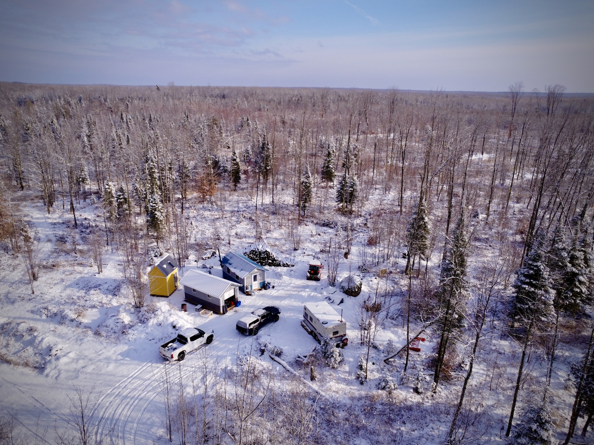 Arial photo of our camp. Three buildings and snow on the ground